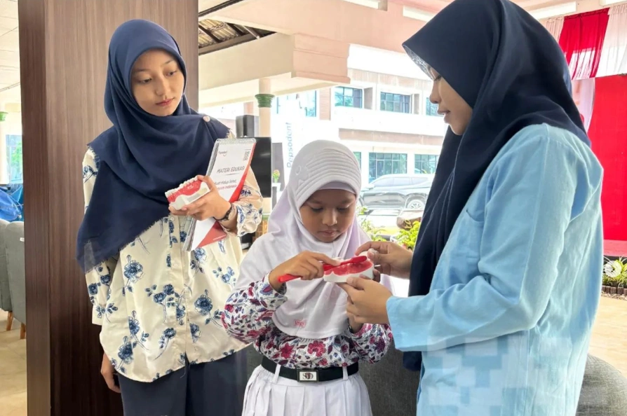 Dental and Oral Health Education: Tooth Brushing Techniques & Topical Fluoride Application at BKGN FKG USU 2024
